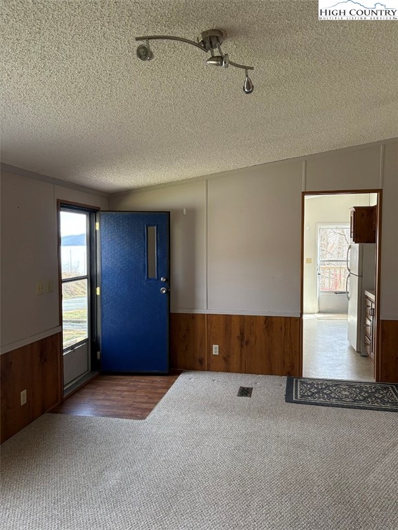 801 Howards Creek Church Road Boone, NC 28607 - Photo 11 of 26 a view of an empty room with window and wooden floor