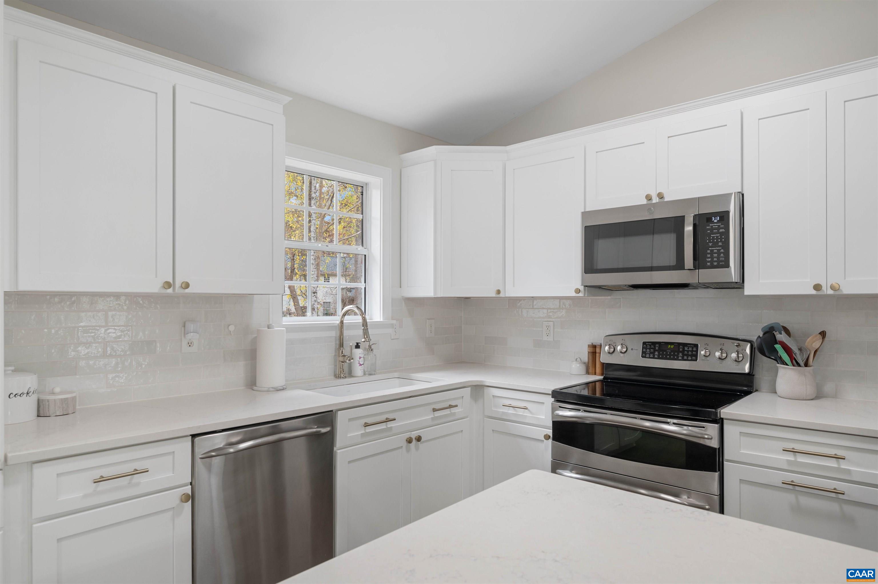 318 Larkspur Road Ruckersville, VA 22968 - Photo 15 of 42 a kitchen with appliances a sink and cabinets