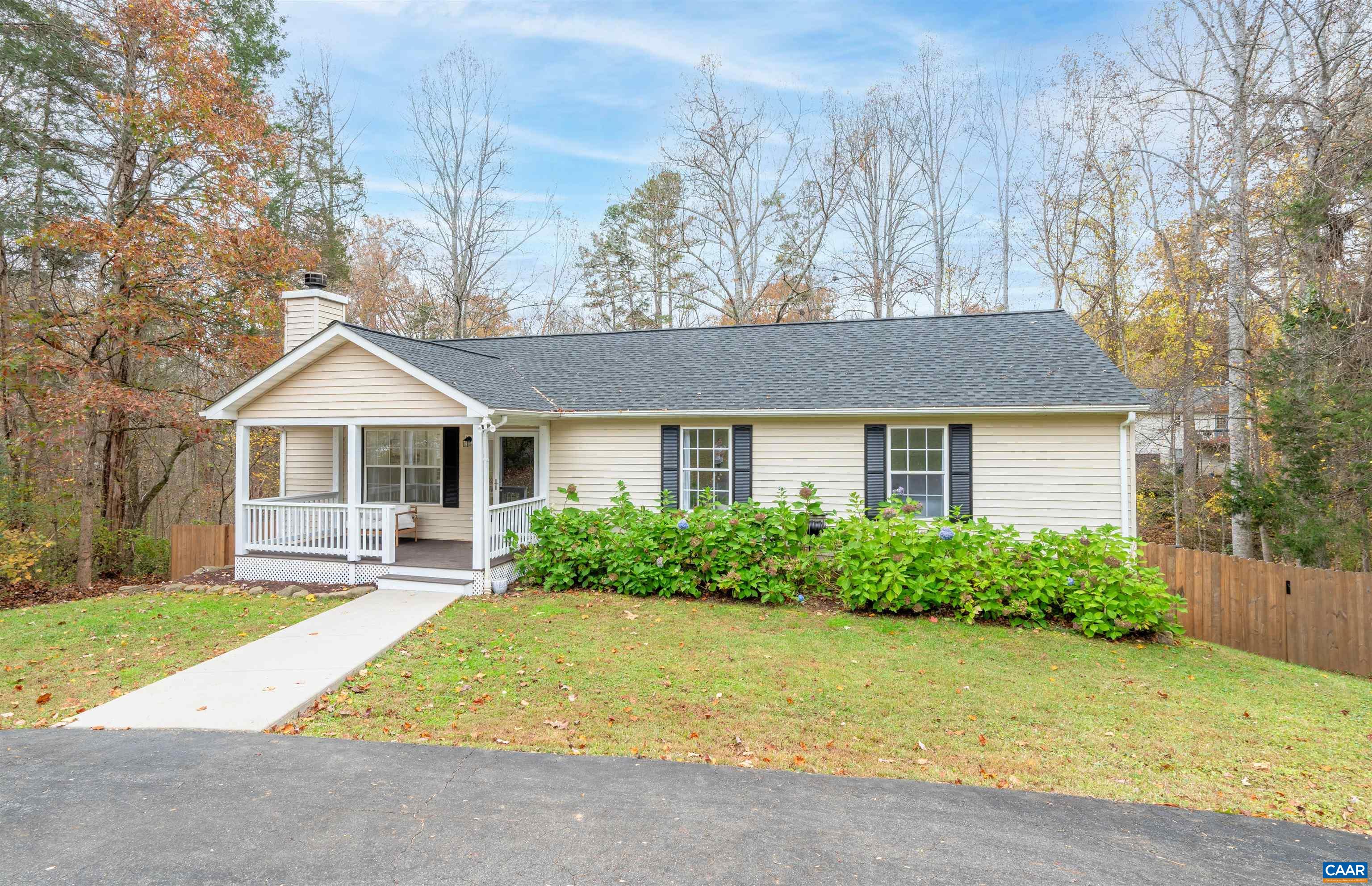 318 Larkspur Road Ruckersville, VA 22968 - Photo 2 of 42 a front view of house with yard and green space
