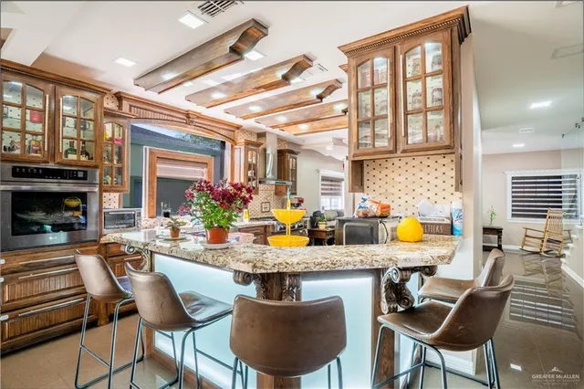 a view of a dining room with furniture a chandelier and wooden floor