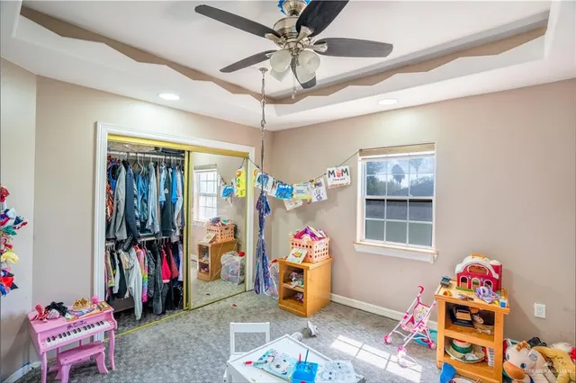 a children room with toys and a window