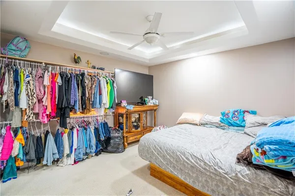 a bedroom with two beds and a walk in closet