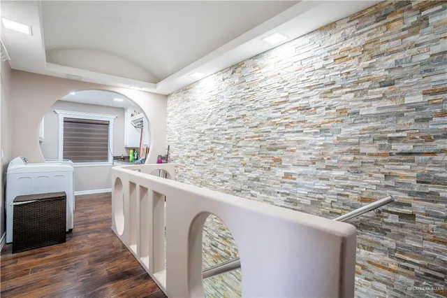 a view of balcony with wooden floor and fence
