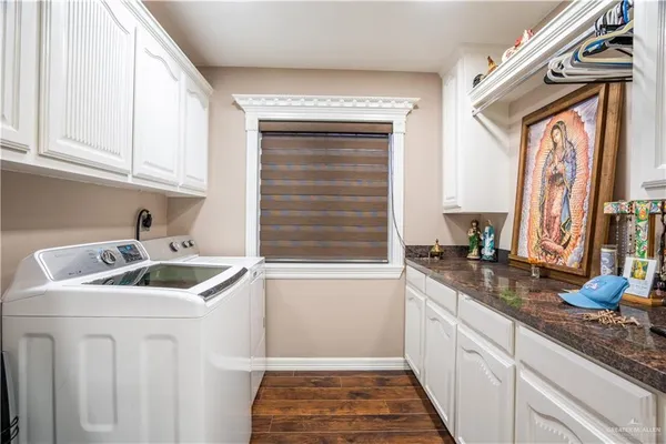 a kitchen with granite countertop a sink and a window
