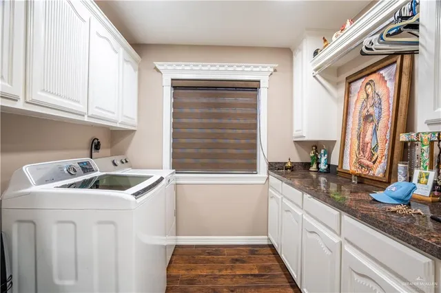 a kitchen with granite countertop a sink and a window