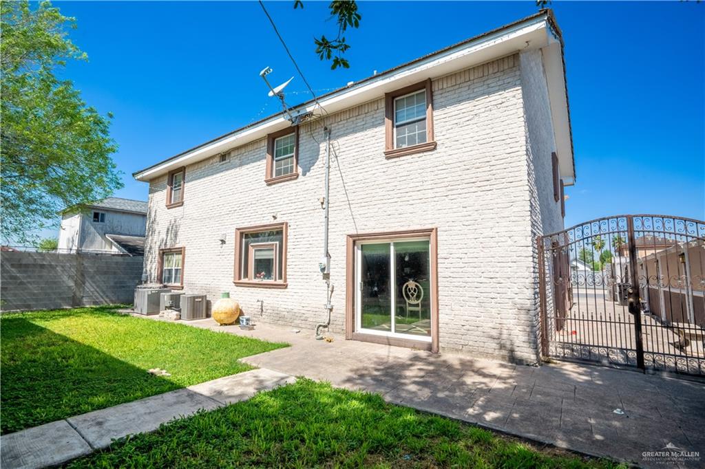306 R Street Weslaco, TX 78596 - Photo 27 of 33 a view of a house with backyard and a garden