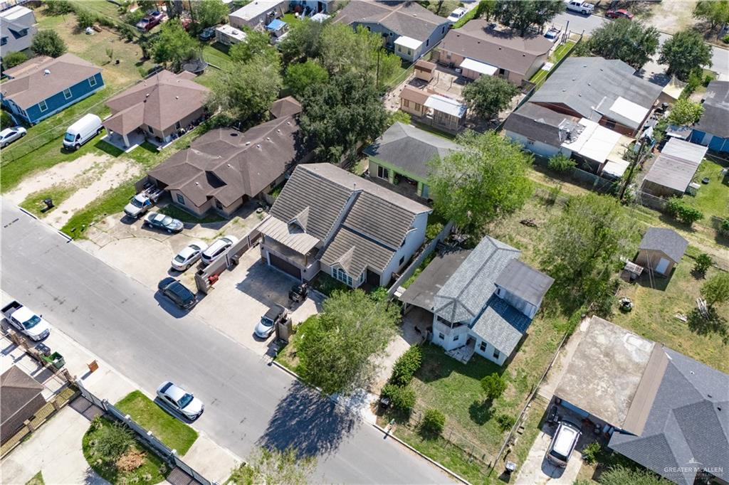 306 R Street Weslaco, TX 78596 - Photo 4 of 33 an aerial view of multiple houses with yard
