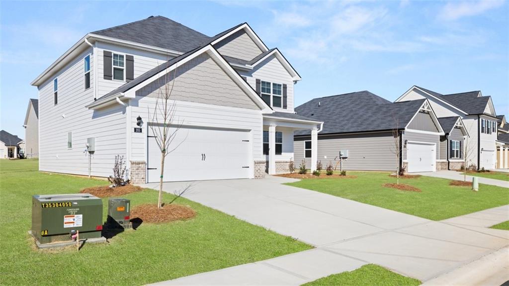211 Cattle Drive Perry, GA 31069 - Photo 3 of 39 a front view of a house with a yard