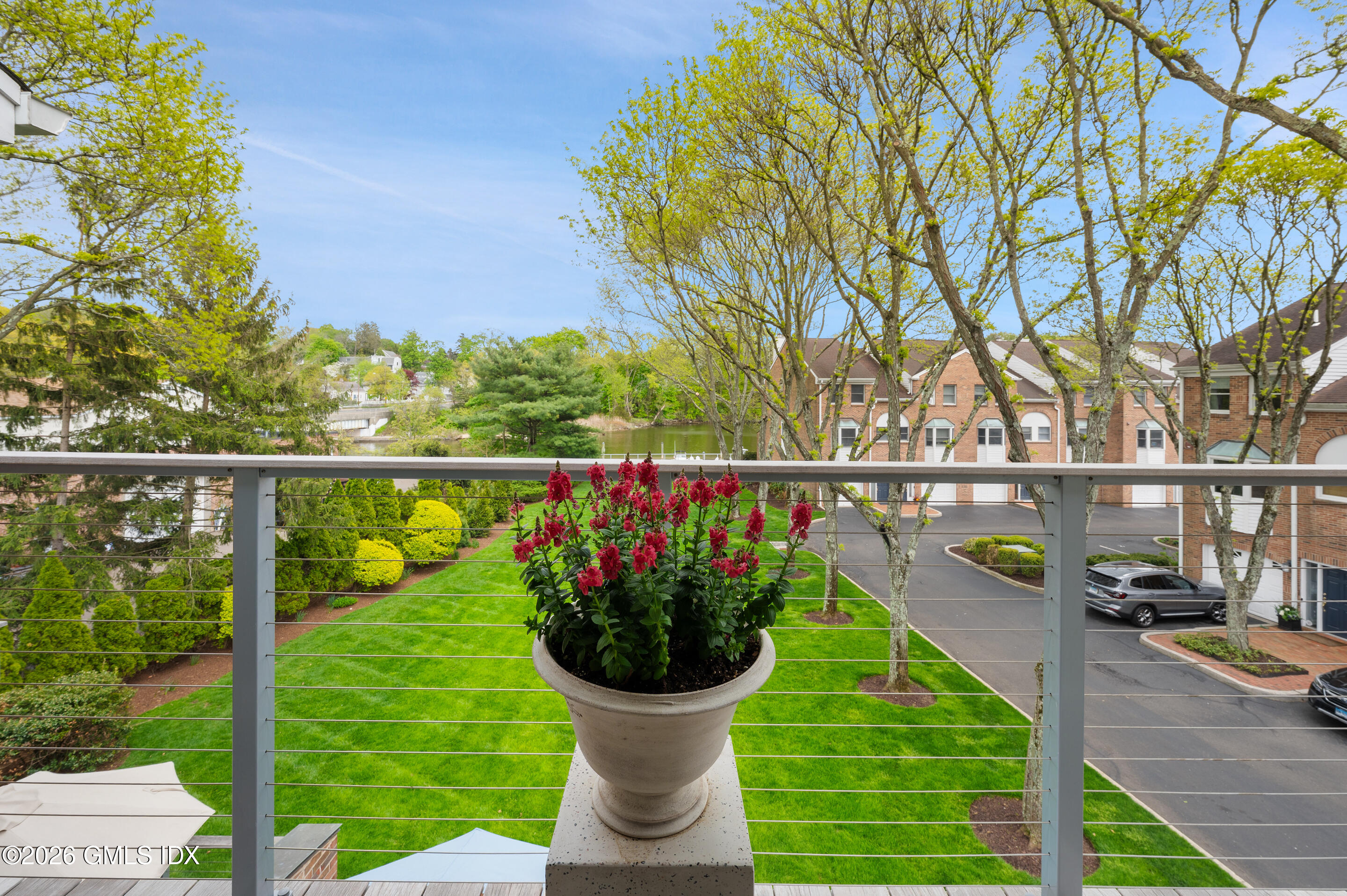 115 River Road, Unit 3 Cos Cob, CT 06807 - Photo 32 of 40 a view of a fountain and a potted plant on the ground