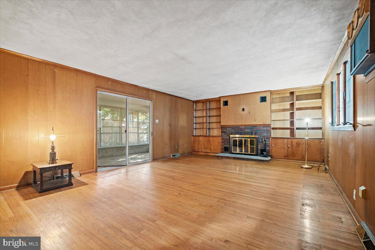 268 Buckner Avenue Haddonfield, NJ 08033 - Photo 20 of 51 a view of a room with wooden floor and floor to ceiling window