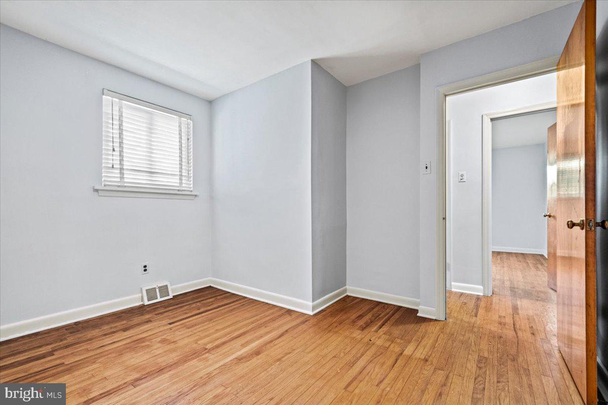 268 Buckner Avenue Haddonfield, NJ 08033 - Photo 29 of 51 a view of a room with wooden floor and a window