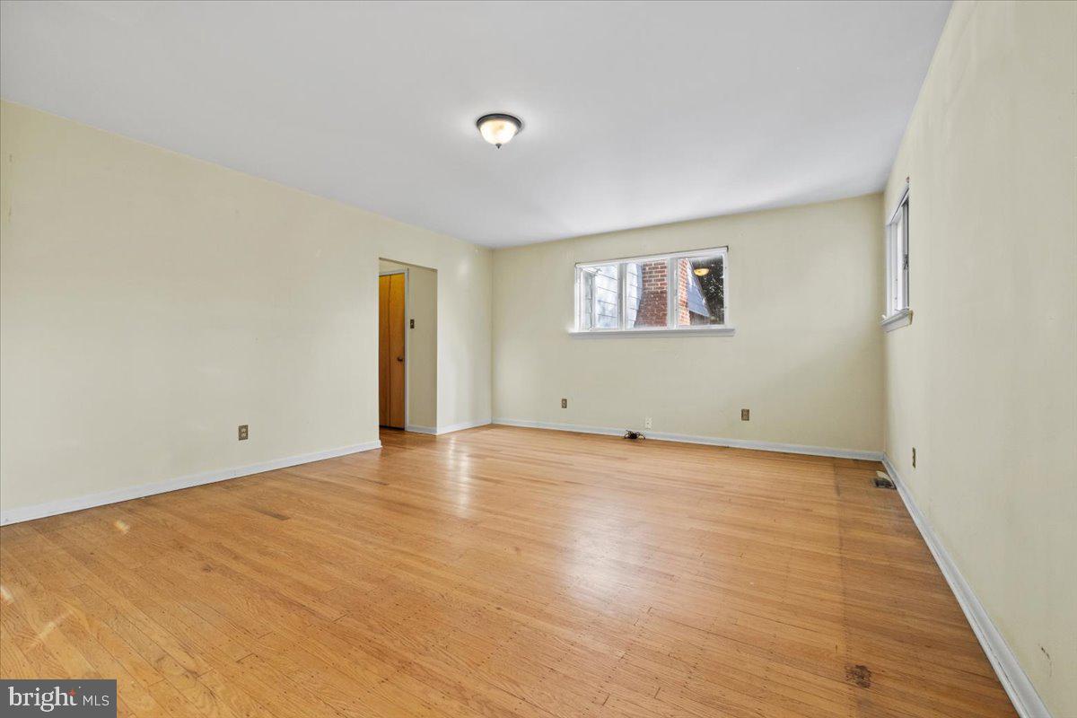 268 Buckner Avenue Haddonfield, NJ 08033 - Photo 36 of 51 a view of an empty room with wooden floor and a window