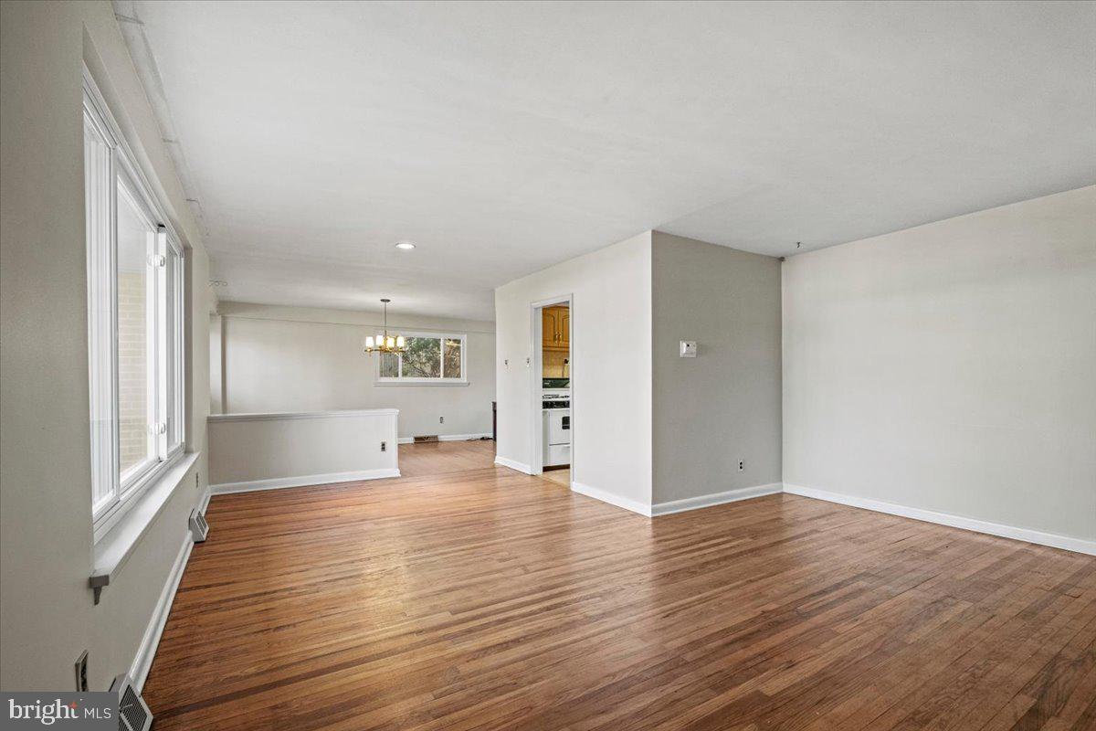 268 Buckner Avenue Haddonfield, NJ 08033 - Photo 4 of 51 a view of a big room with wooden floor and windows