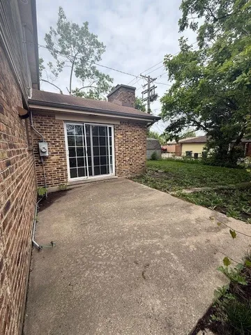 a view of a house with a yard and garage