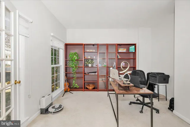 a view of a workspace with furniture