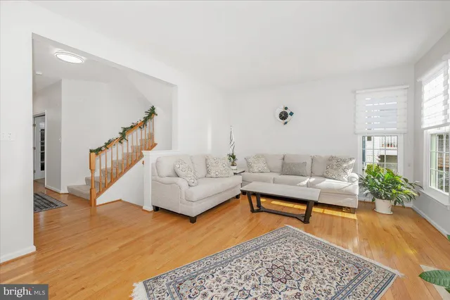 a living room with furniture and a rug