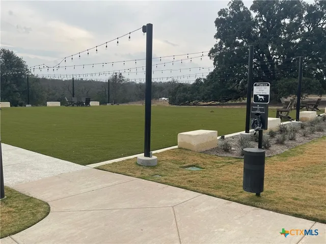 a view of a lake with a bench next to a lake
