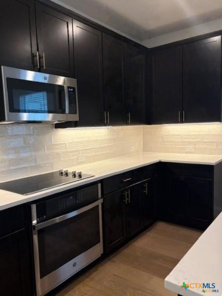 413 Blue Sage Lane Salado, TX 76571 - Photo 4 of 14 a kitchen with stainless steel appliances wooden cabinets and sink