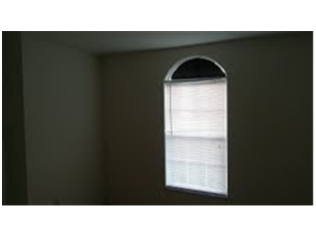 694 Southwest Heather Street Port St. Lucie, FL 34983 - Photo 13 of 13 a black and white photo of a black and white wall