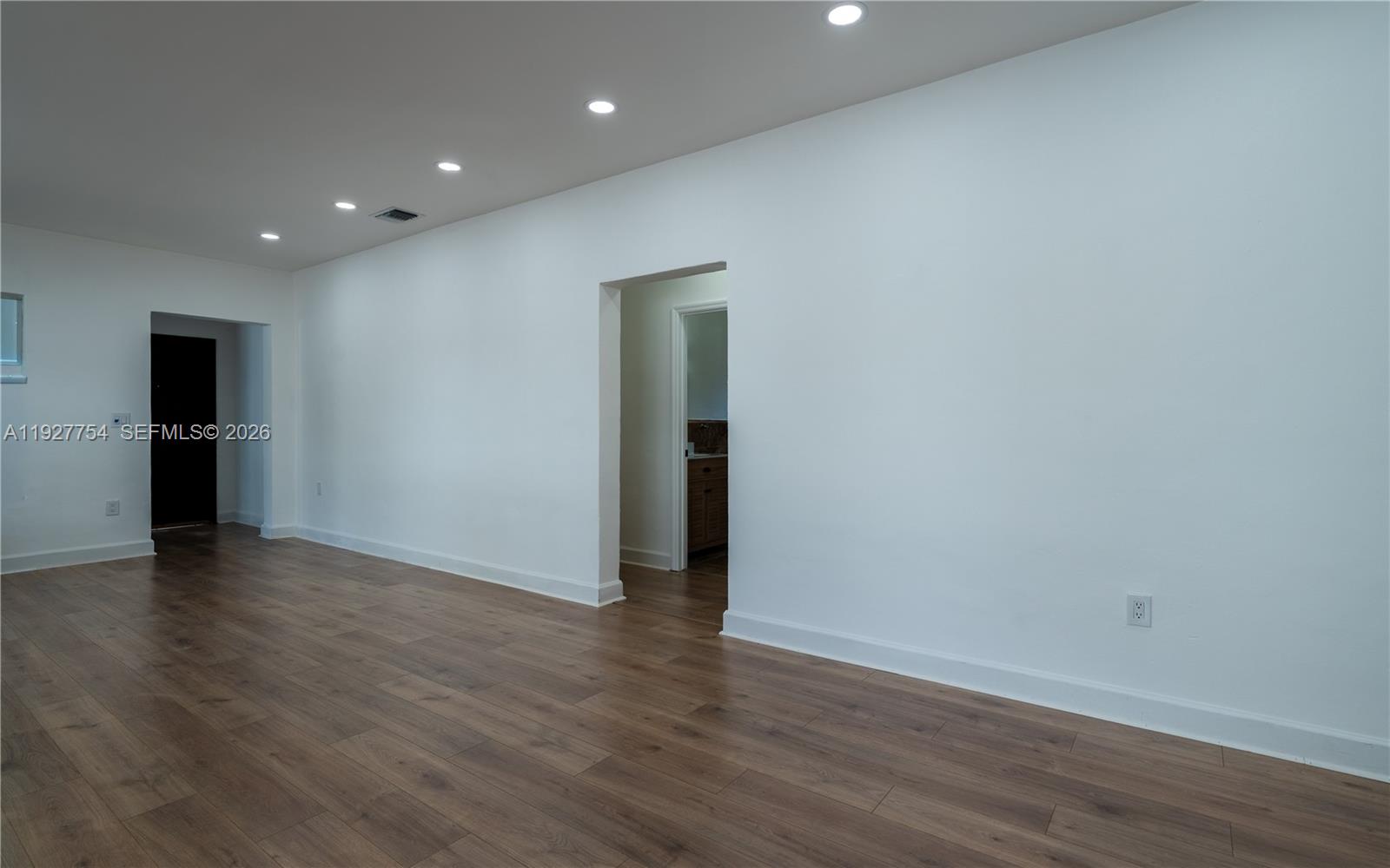 426 Southwest 26th Road Miami, FL 33129 - Photo 11 of 12 an empty room with wooden floor and closet