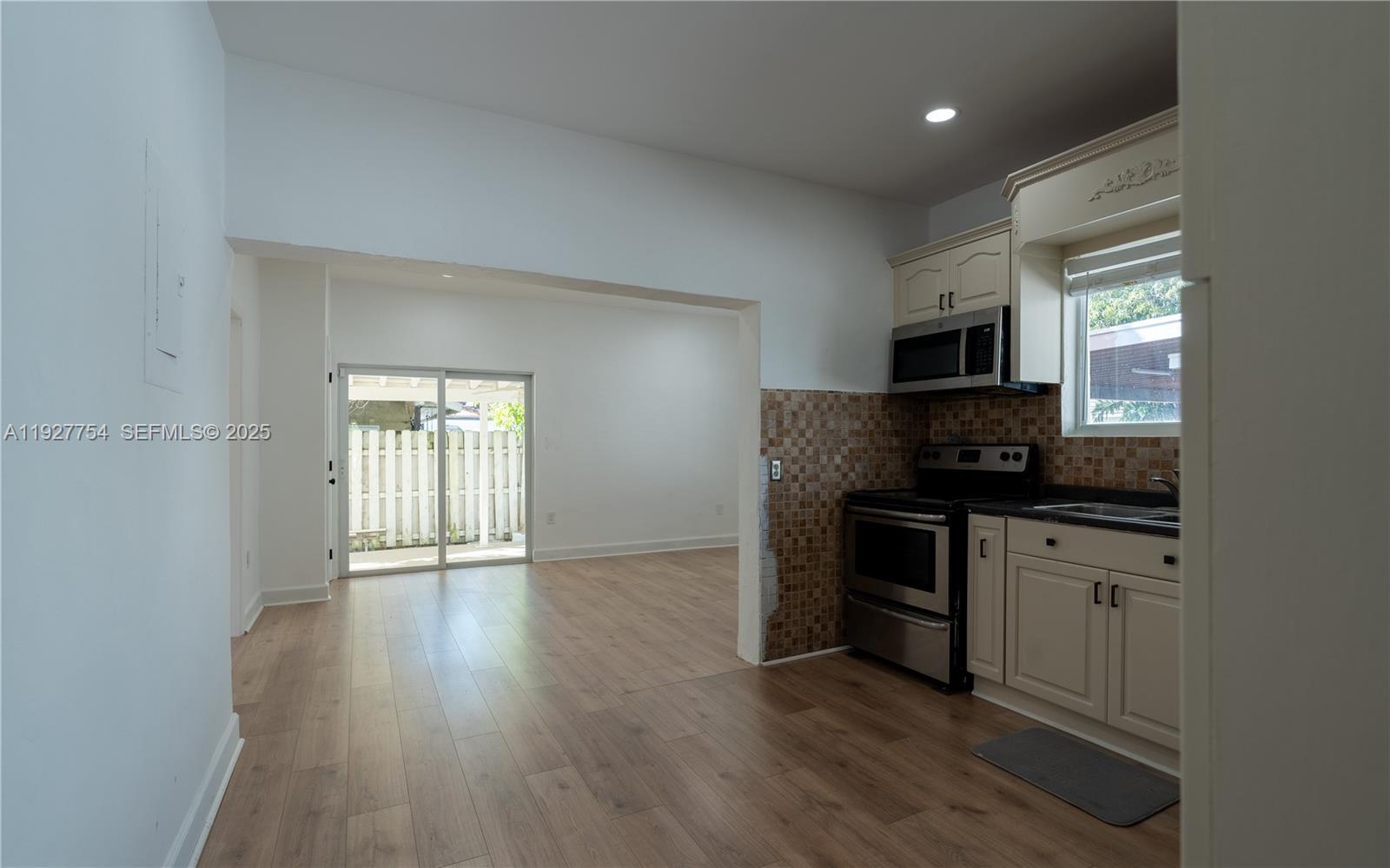 426 Southwest 26th Road Miami, FL 33129 - Photo 9 of 13 a kitchen with a sink and a stove top oven