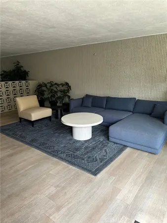 a living room with furniture and a rug