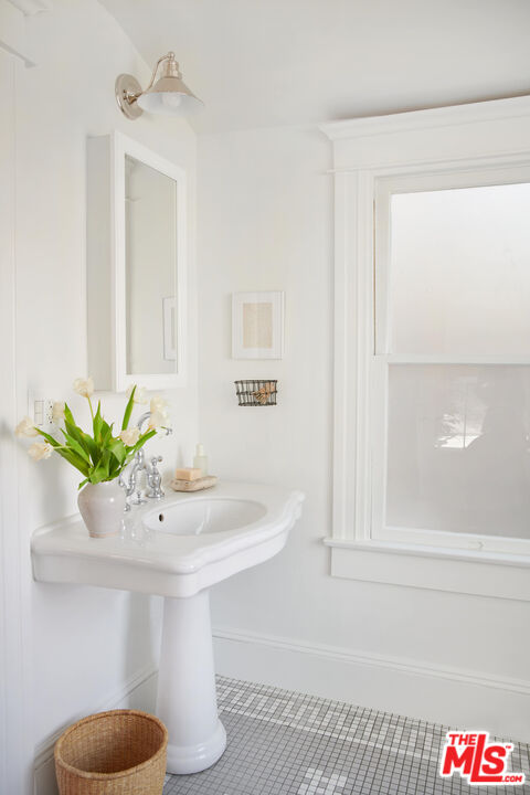 6506 Ruby Street Los Angeles, CA 90042 - Photo 14 of 21 a bathroom with a sink and a mirror