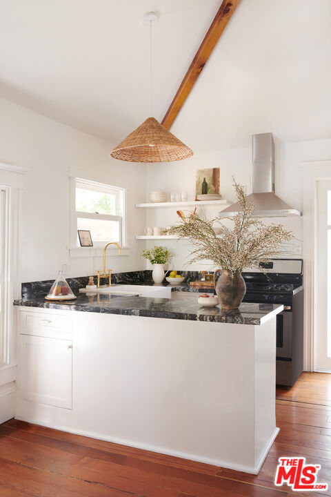 6506 Ruby Street Los Angeles, CA 90042 - Photo 7 of 21 a kitchen with stainless steel appliances granite countertop a sink and a stove