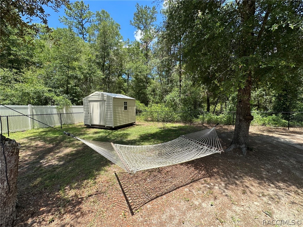 8434 North Vardon Road Citrus Springs, FL 34434 - Photo 25 of 29 Fenced yard with shed