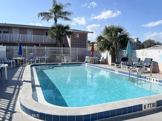 a view of a swimming pool with a patio
