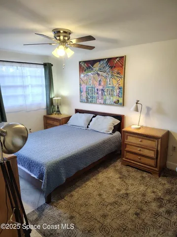 a bedroom with a bed and dresser