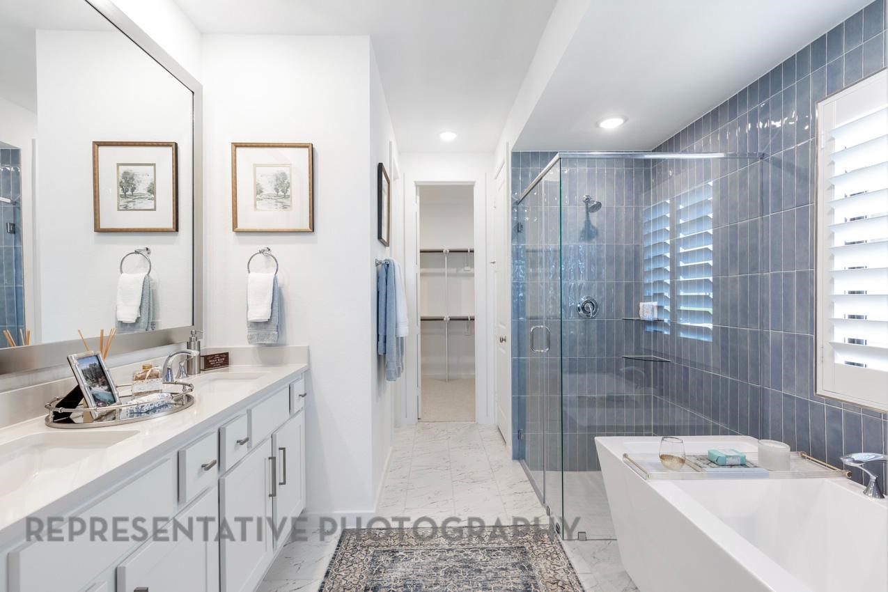 2538 Mission Heights Way Manvel, TX 77578 - Photo 11 of 24 a bathroom with a double vanity sink mirror and shower