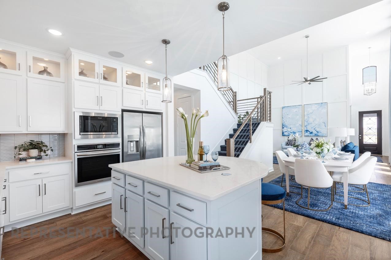 2538 Mission Heights Way Manvel, TX 77578 - Photo 3 of 24 a kitchen with a appliances a sink and cabinets