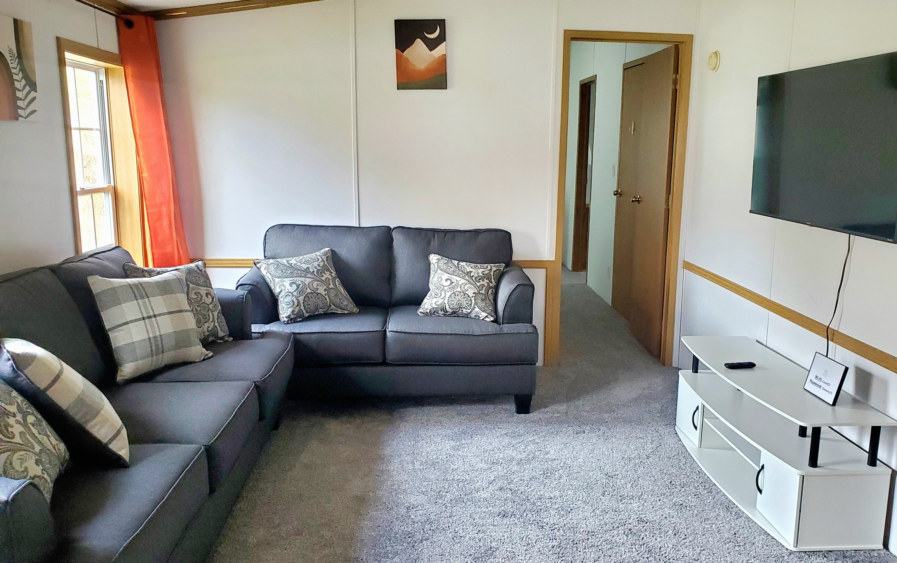 5 Mount Laurel Road Norwich, CT 06360 - Photo 13 of 15 a living room with furniture and a flat screen tv