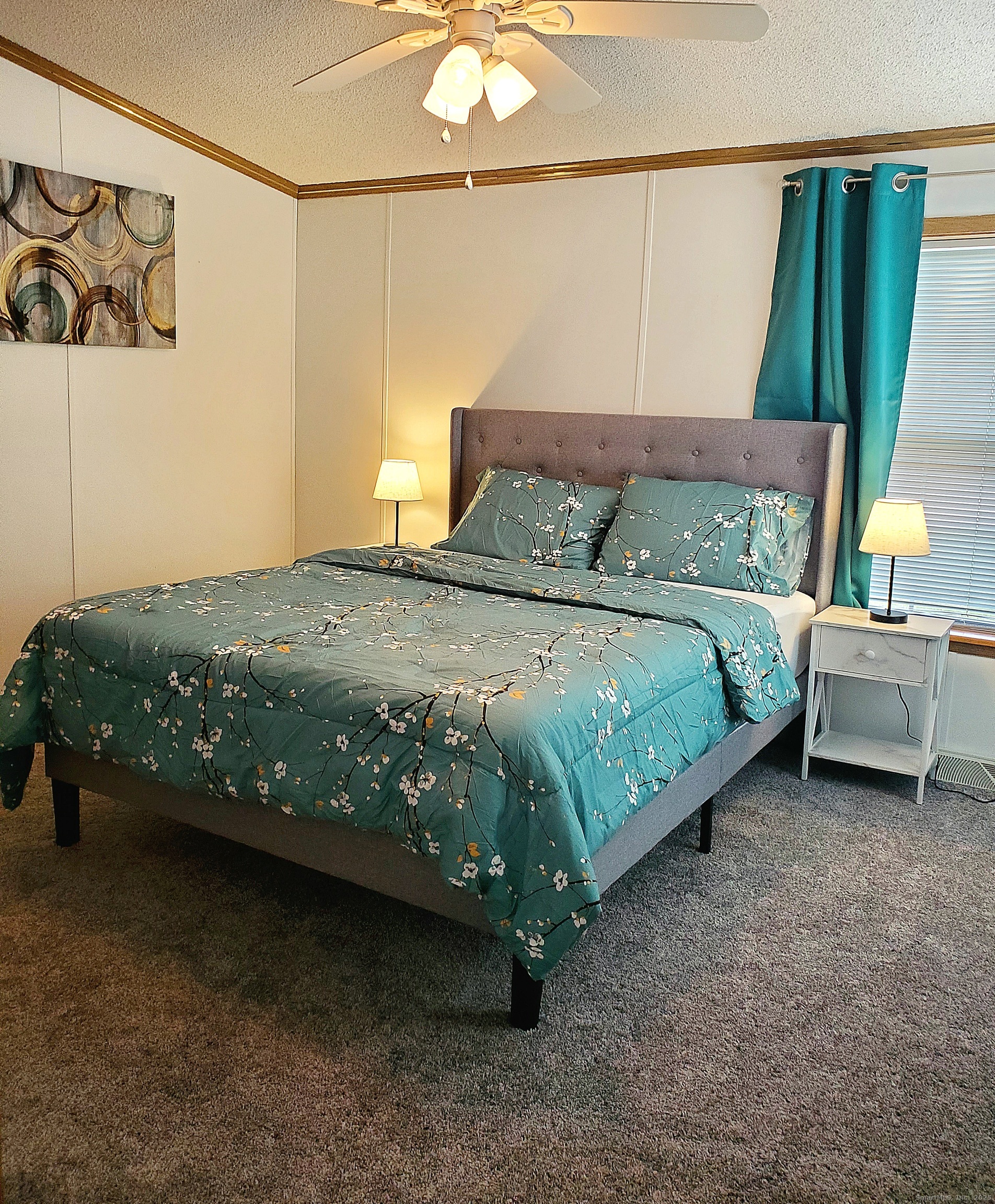 5 Mount Laurel Road Norwich, CT 06360 - Photo 4 of 15 a bedroom with a bed and a painting on the wall