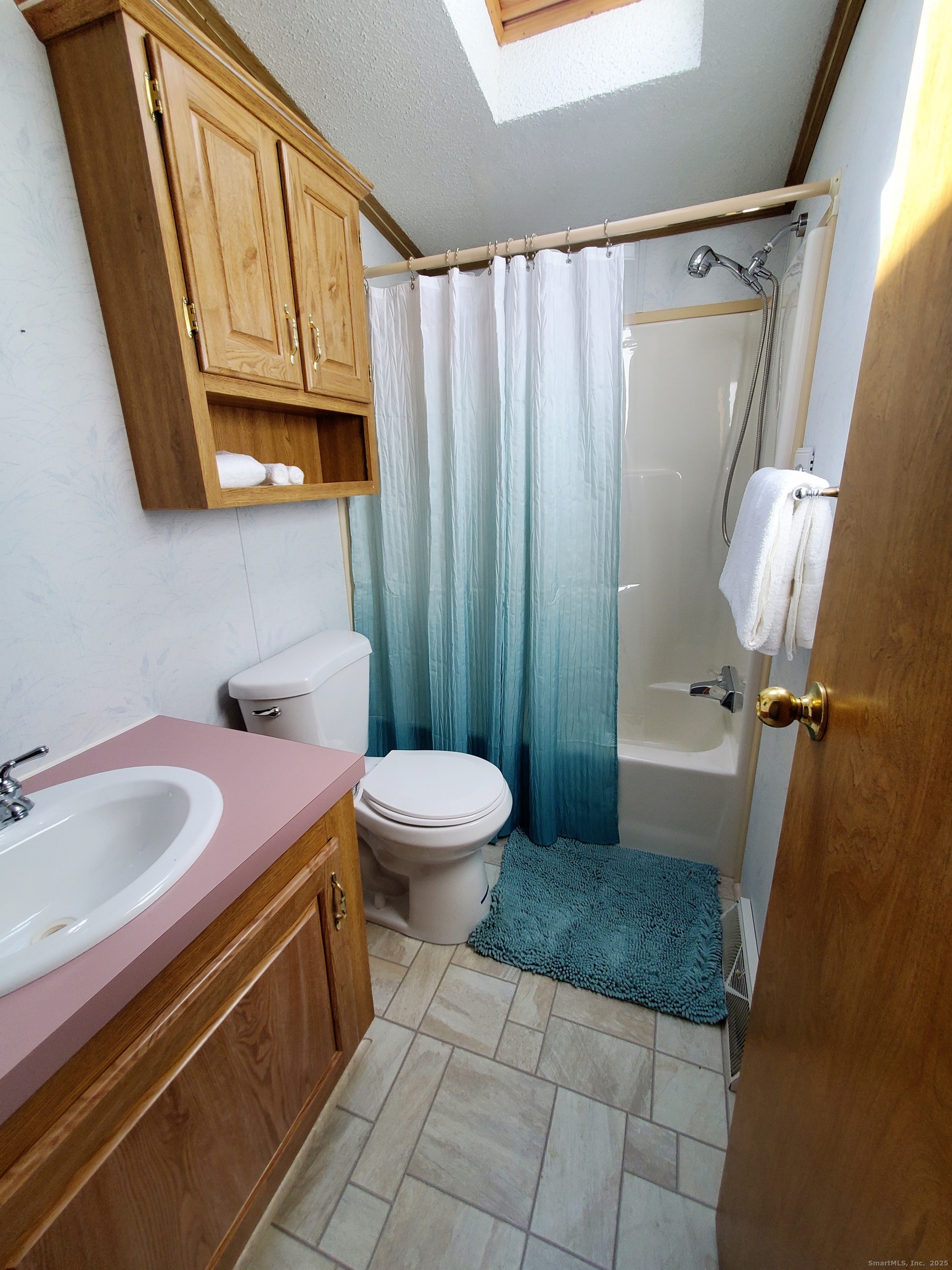 5 Mount Laurel Road Norwich, CT 06360 - Photo 7 of 15 a bathroom with a granite countertop sink toilet and shower