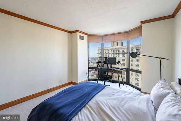 a bedroom with a bed and a closet in it