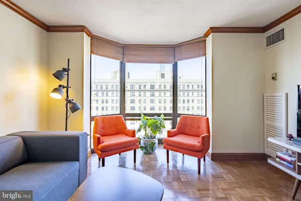 a living room with furniture and a window