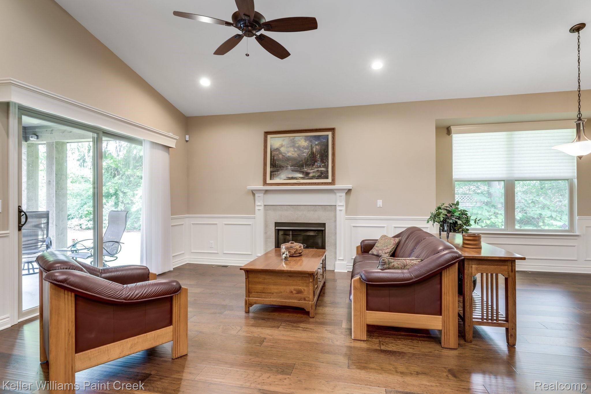1027 Hampshire Court Rochester, MI 48307 - Photo 15 of 30 Great room offers a ceramic fireplace and a doorwall to patio.