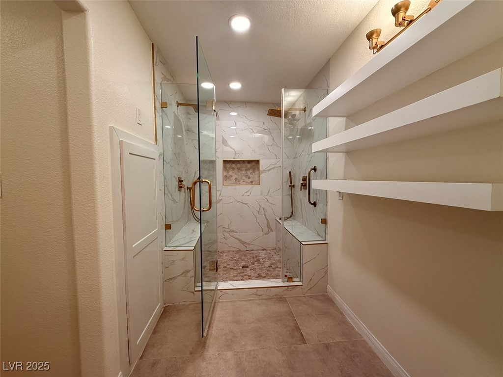 4969 Jeremy Drive Las Vegas, NV 89113 - Photo 30 of 73 Bathroom featuring a marble finish shower and recessed lighting