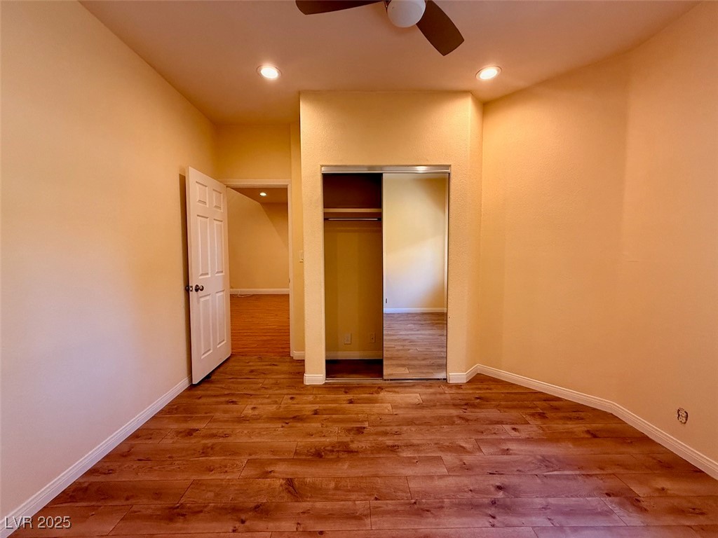 4969 Jeremy Drive Las Vegas, NV 89113 - Photo 38 of 73 Unfurnished bedroom with light wood finished floors, a closet, recessed lighting, and a ceiling fan