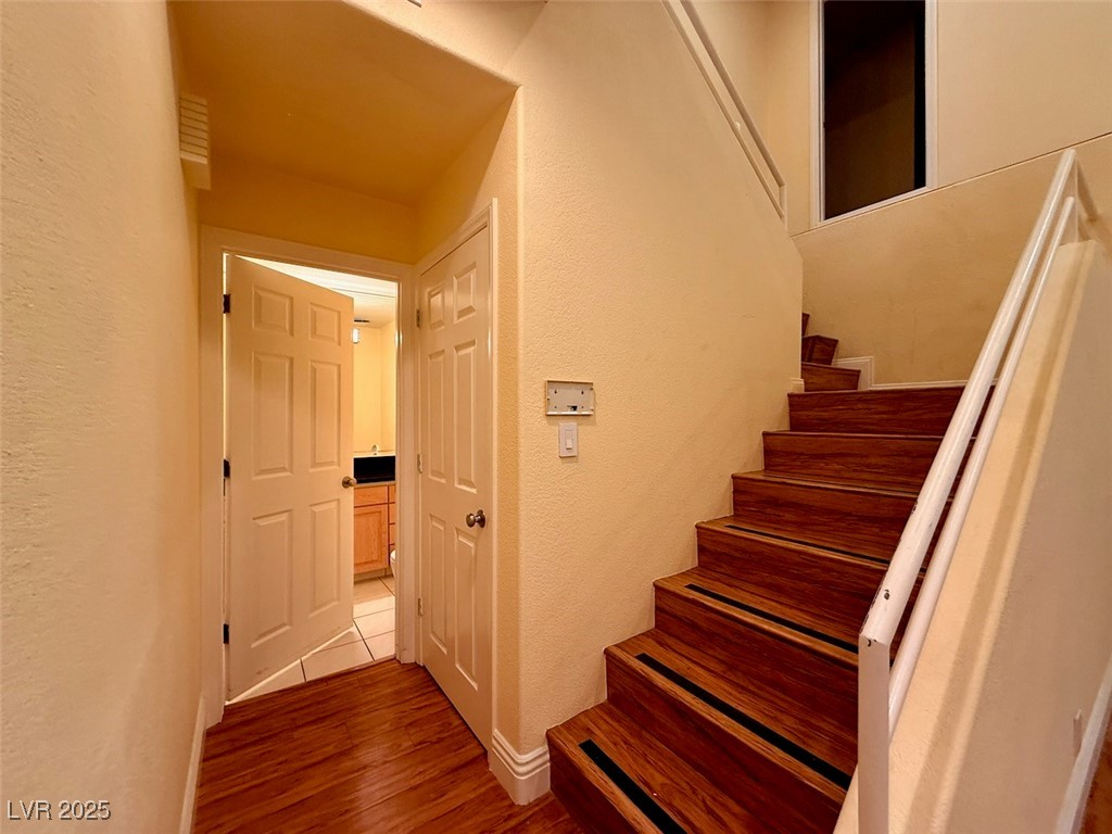 4969 Jeremy Drive Las Vegas, NV 89113 - Photo 39 of 73 Stairway featuring a textured wall and wood finished floors