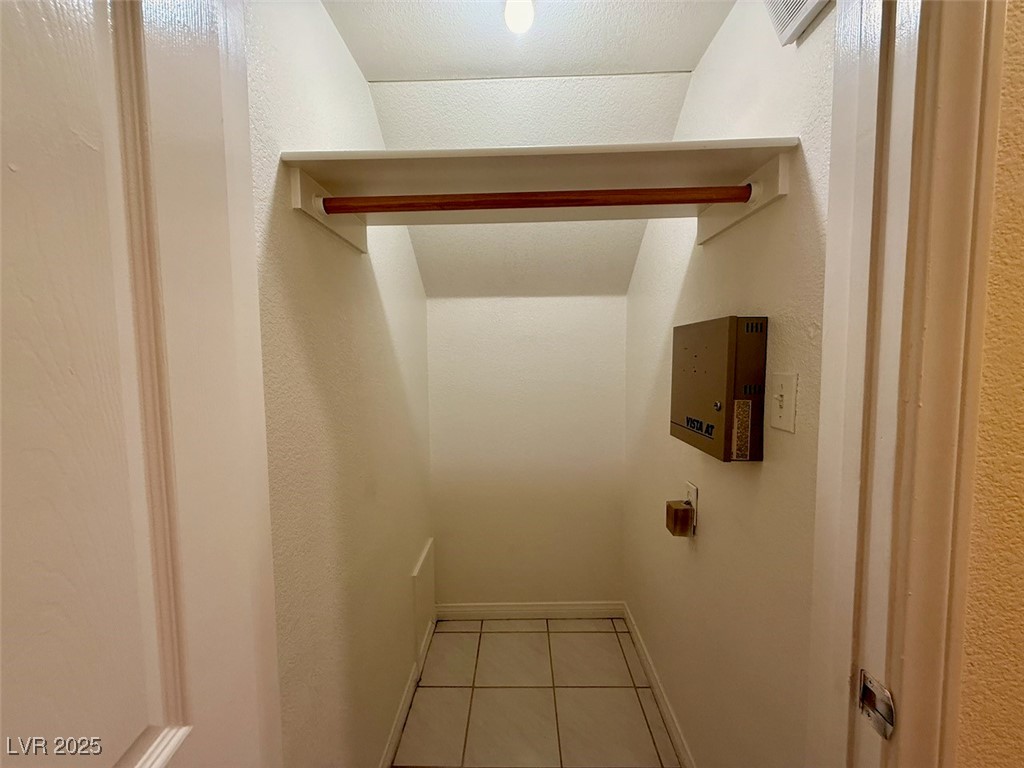 4969 Jeremy Drive Las Vegas, NV 89113 - Photo 40 of 73 Walk in closet with light tile patterned flooring