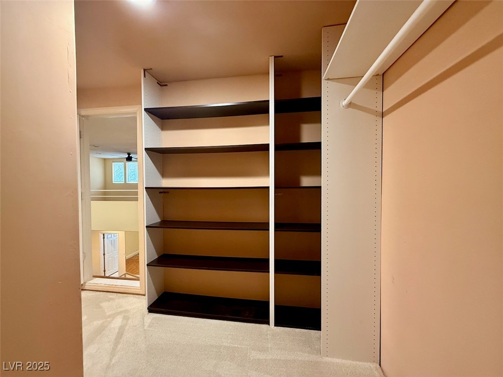 4969 Jeremy Drive Las Vegas, NV 89113 - Photo 61 of 73 Walk in closet featuring light colored carpet