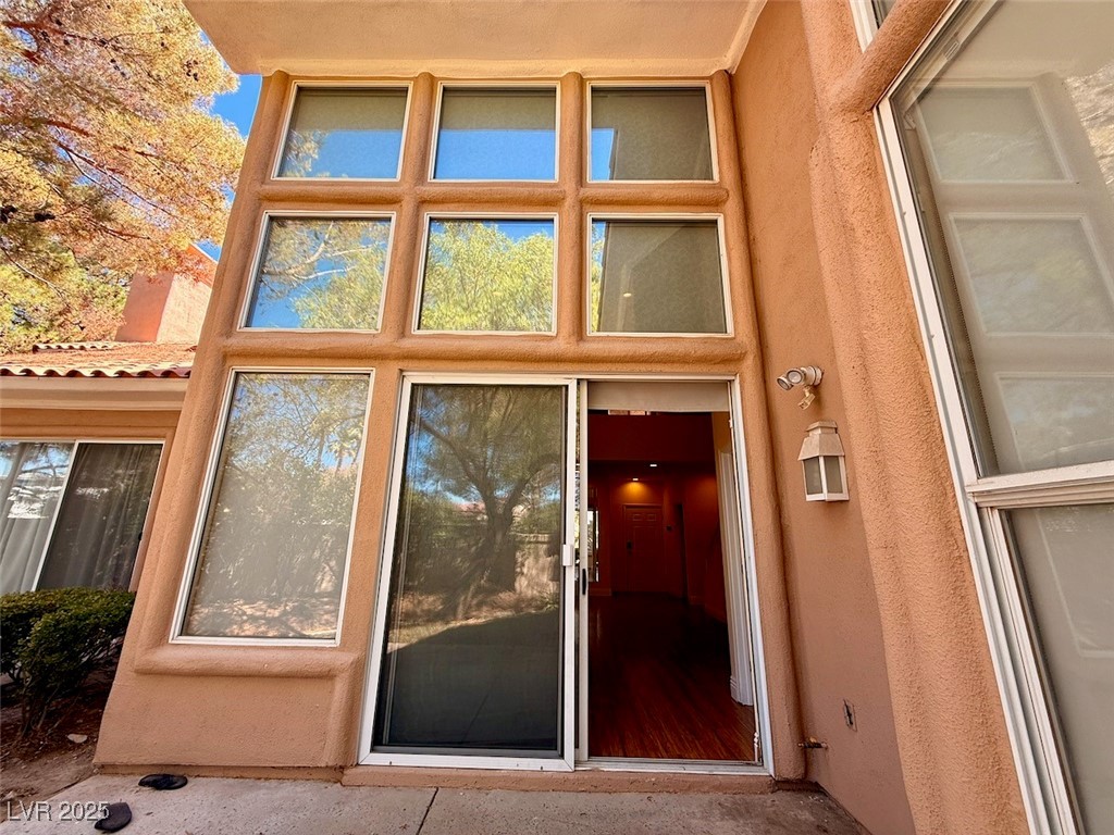 4969 Jeremy Drive Las Vegas, NV 89113 - Photo 67 of 73 Doorway to property with stucco siding