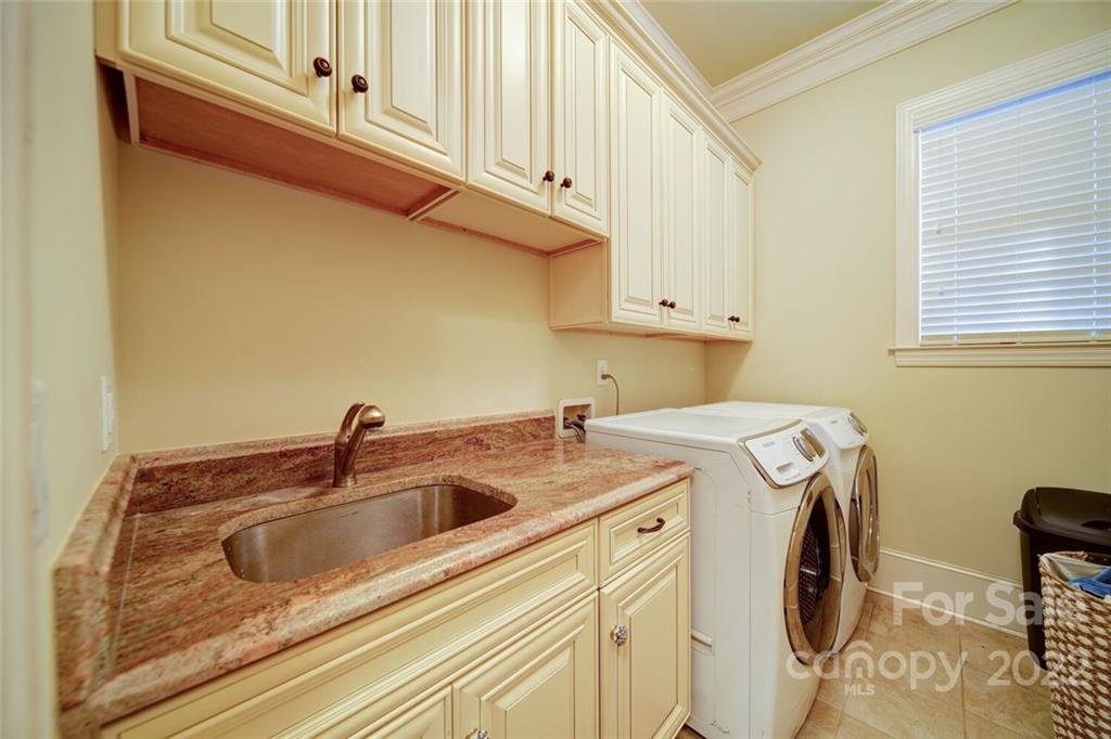 174 Birdie Drive Stanley, NC 28164 - Photo 11 of 46 a utility room with dryer and washer