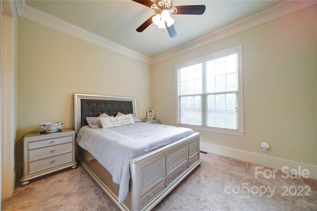 174 Birdie Drive Stanley, NC 28164 - Photo 17 of 46 a bedroom with a bed and window