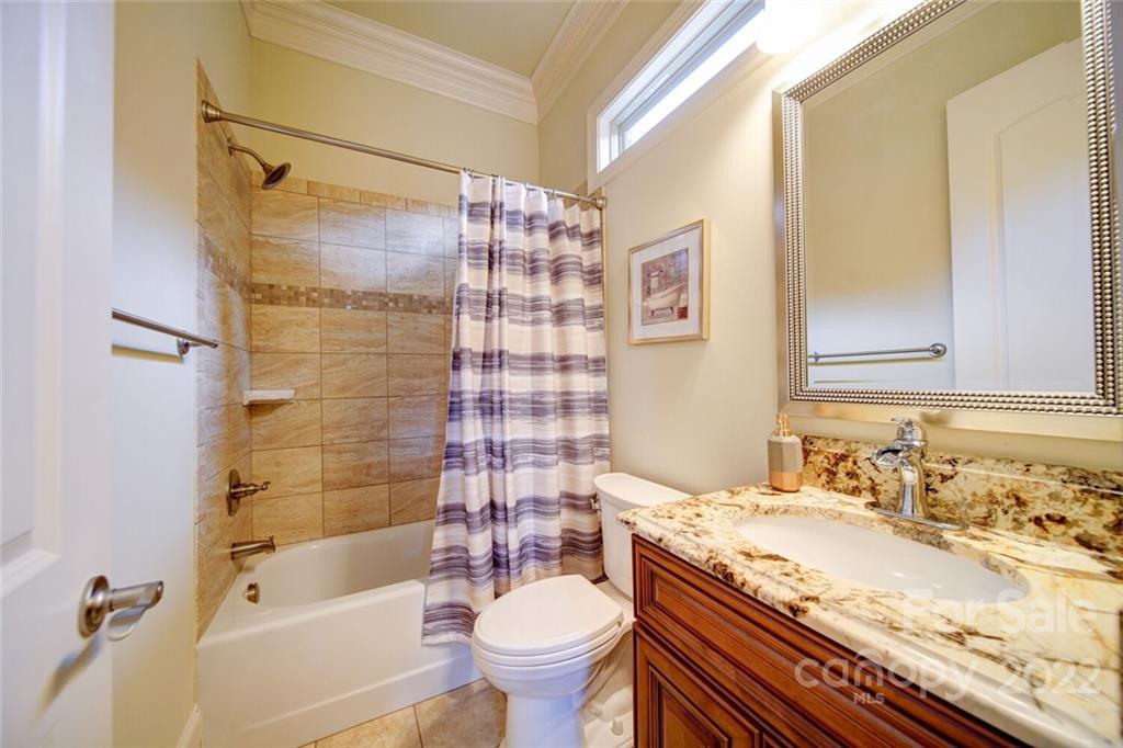 174 Birdie Drive Stanley, NC 28164 - Photo 18 of 46 a bathroom with a granite countertop sink toilet mirror and shower