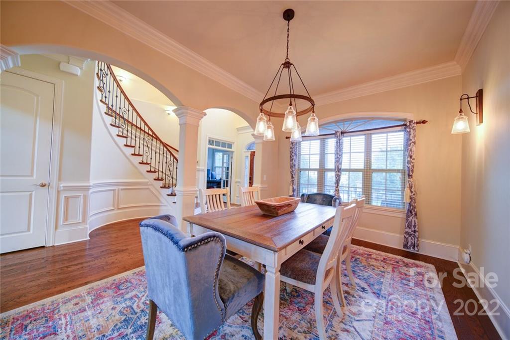 174 Birdie Drive Stanley, NC 28164 - Photo 19 of 46 a view of a dining room with furniture window and wooden floor