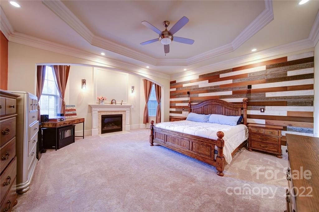174 Birdie Drive Stanley, NC 28164 - Photo 22 of 46 a living room with furniture and a fireplace